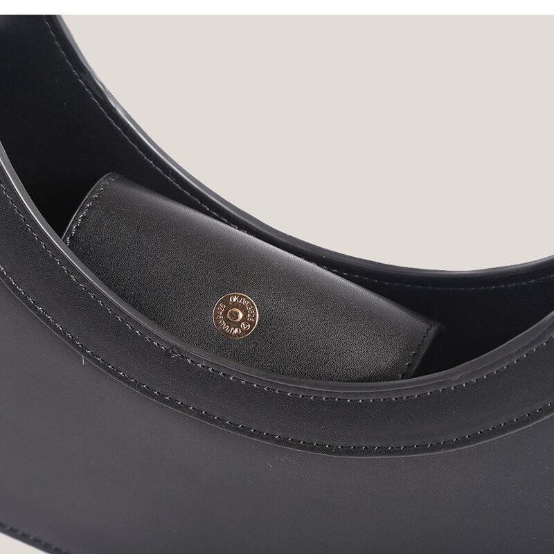 Sculptural Ring Handle Mini Handbag
